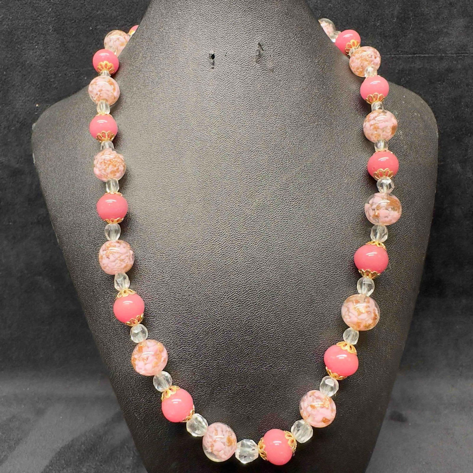 Venetian Murano Lamp Work Art Glass Pink Copper Swirls Round Beaded Necklace C38: Venetian Murano Lamp Work Art Glass Pink Copper Swirls Round Beaded Necklace C38. Necklace with pink colored glass beads with beautiful designs on each. The necklace features copper infused accents. T