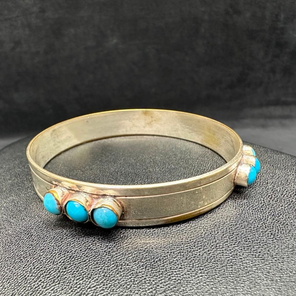 Sterling Small Turquoise Bangle: This piece of jewelry has been tested and researched prior to listing. Please view all our pictures they are part of our description. DETAILS: Metal - Sterling Silver Color - Silver Stones - Turquoise