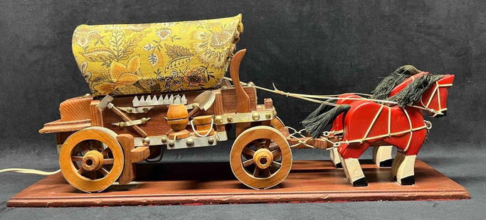 Hand Carved Folk Art From Eatonville Fl Wagon & Horses Lamp: This lot contains Hand Carved Folk Art From Eatonville Fl Wagon & Horses Lamp. Eatonville&nbsp;was the first all black incorporated town in the United States. Established in 1887. It is approx 24 1/4"