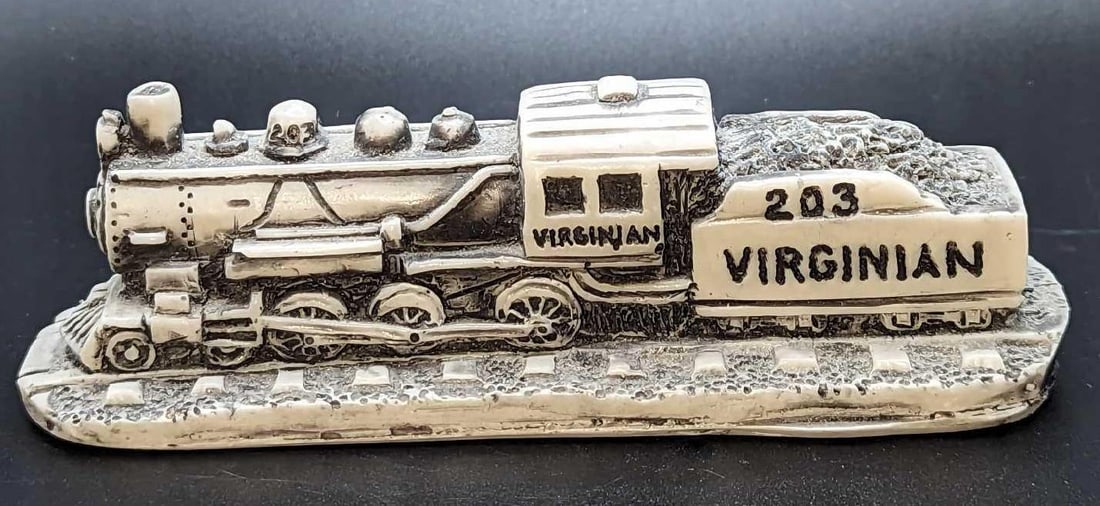 LE Georgia Marble Trains Gone By Collection Virginian: LE Georgia Marble Trains Gone By Collection Virginian. This one is #657 out of #3000. This marble train is approx 6" x 2" x 1 3/4" and it weighs 0.56lb. There is some wear and sticker residue on the b