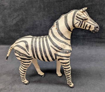 Vintage Paper Mache Leather Zebra Figurine: Vintage Paper Mache Leather Zebra Figurine. The maker and date of creation is unknown. Hand made and hand painted. The figurine is approx 12" x 15" x 4" and it weighs 1.39lb. The zebra has some