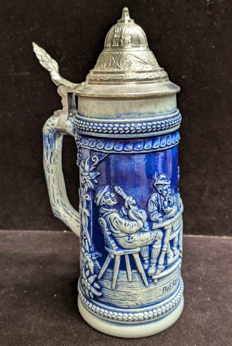 Vintage Auder Alm Pottery Stein With Pewter Top: Vintage Auder Alm Pottery Stein With Pewter Top. This is approx 5 1/4" x 3 3/4" x 9 3/4" and it weighs 1.88lb. The maker and date of creation is unknown. The top and insides have some markings.