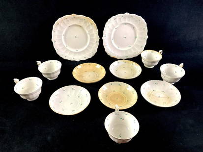 Set of (12) Pieces of Bone China: This lot includes:   (5) Small Bone China Cups  (5) Small Bone China Plates (2) Large Bone China Plates    Condition is used and refer to photographs for additional deta