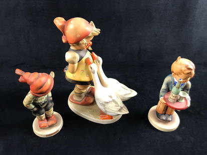 Hummel Figurines Vintage Large Figure Plus Two Reg: Here is a lot of three Goebel Hummel Figurines made in West Germany during the &#39;60s/70&#39;s. Hand-painted porous earthenware. This lot includes:  (1) March Winds. TMK-3. Is approx 2&#34; x 2 x 5&