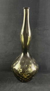 Vintage Blow Glass Black Vase Made In Italy: Vintage Blow Glass Black Vase Made In Italy Pictured is a black hand blow vase. It has a "made in Italy" sticker on it. The vase is in good condition with some slight scratch and chip on the