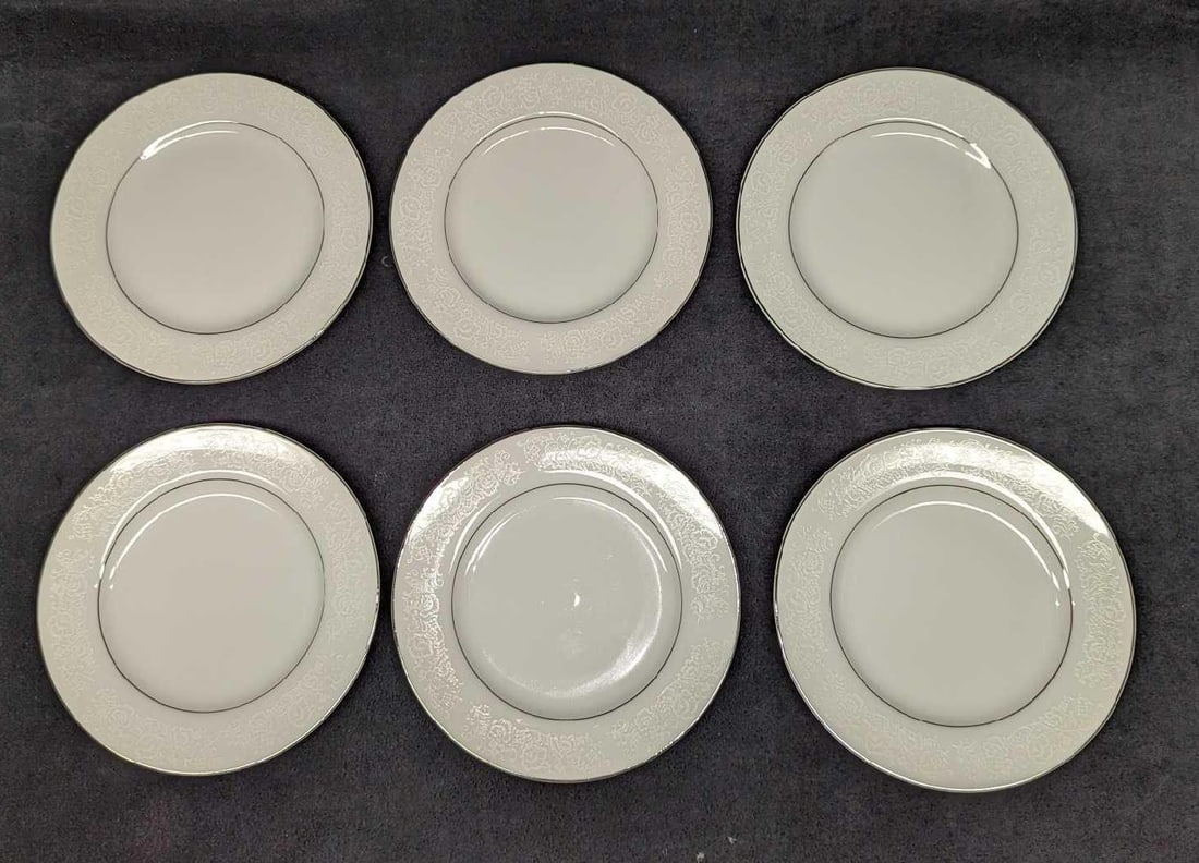 6 Retired International Juliet Bread & Butter Plates B: 6 Retired International Juliet Bread & Butter Plates B. Each plate is approx 6 3/8" x 6 3/8" x 5/8" and the total weight is 2.42lb. The plates are made of fine china and do not have any chips or crack
