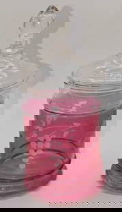 Vintage Etched Cranberry Style Glass Candy Dish: Vintage Etched Cranberry Style Glass Candy Dish. This is approximately 3" x 3" x 7" and it weighs 0.56lb. The top has very small chips on the bottom.