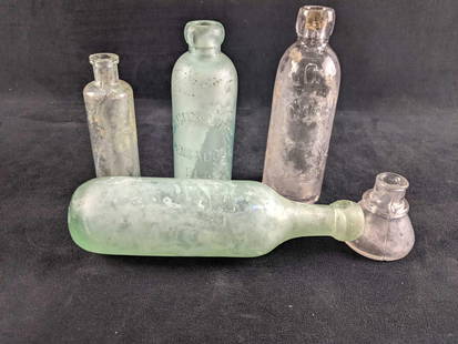 Five Antique Glass Bottles: Five Antique Glass Bottles This lot has five antique glass bottles These bottles are in antique condition with some fogged glass and a few chips. One bottle was designed to lay on its side. These are