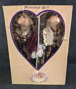 Porcelain Dolls Goldenvale Collection Girl and Boy: Porcelain Dolls Goldenvale Collection Girl and Boy This lot comes with a set of porcelain dolls a girl and a boy with kissing faces. They are in their original box never opened. They are still fastene