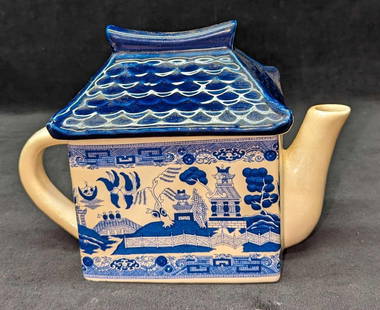 Vintage Blue Willow Porcelain Pagoda Large Tea Pot: Vintage Blue Willow Porcelain Large Tea Pot. This is approx 9 1/4" x 4 3/8" x 7" and it weighs 1.91lb. The teapot has some discoloration due to age along with some signs of wear. Please see the images