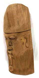 Hand Carved Acacia Wood Male Head Wall Hanging: This lot contains a hand carved male head wall hanging made of acacia&nbsp;wood. The sticker on the back of the wall hanging states that the artwork was made in Haiti. It is approx 17" x 6 3/4" and we