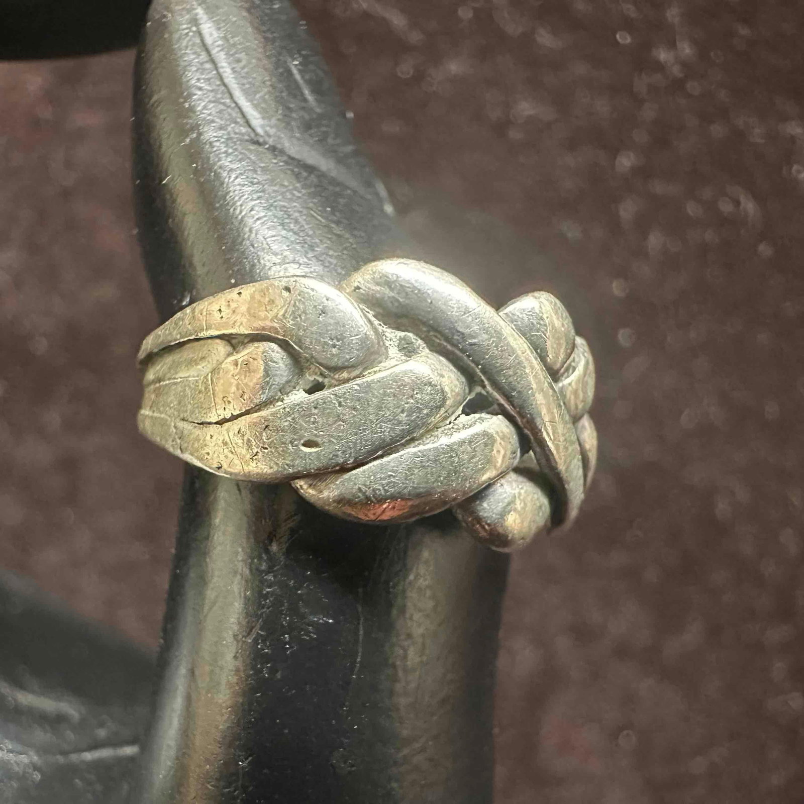 Knot Weaved Ribbon Puzzle Sterling Silver Ring: This item is in good pre-owned, previously used/displayed condition with noticeable light wear, and surface scratches. Please reference all photos for full details. This piece of jewelry has been test