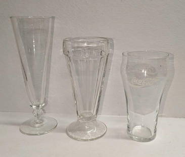 3 Vintage Coca-Cola Tall Beer Soda Fountain Glasses: 3 Vintage Coca-Cola Tall Beer Soda Fountain Glasses. This lot contains:  (1) Vintage Tall Beer Glass. This is approx 2 3/4&#34; x 2 3/4&#34; x 8 1/2&#34;. (1) Vintage Soda Fountain Glass. This is appr