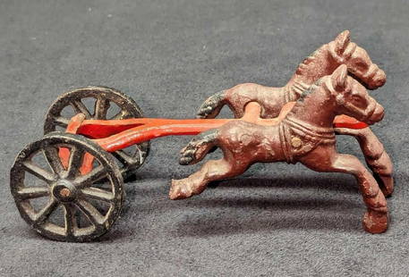 Vintage Cast Iron 2 Horse Toy: Vintage Cast Iron 2 Horse Toy. This is approx 6" x 2 1/4" x 2 1/2" and it weighs 0.55lb. The toy has some light surface rust and some color loss. Please see the images as they are part of the descript