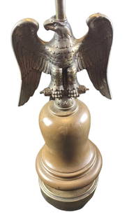 Vintage American Eagle Cast Resin Lamp: Vintage American Eagle Cast Resin Lamp. Made to resemble brass. The maker and date of creation are unknown. The bottom of the lamp resembles a bell. Is approx 7" x 7" x 31" without the lampshade. 12"