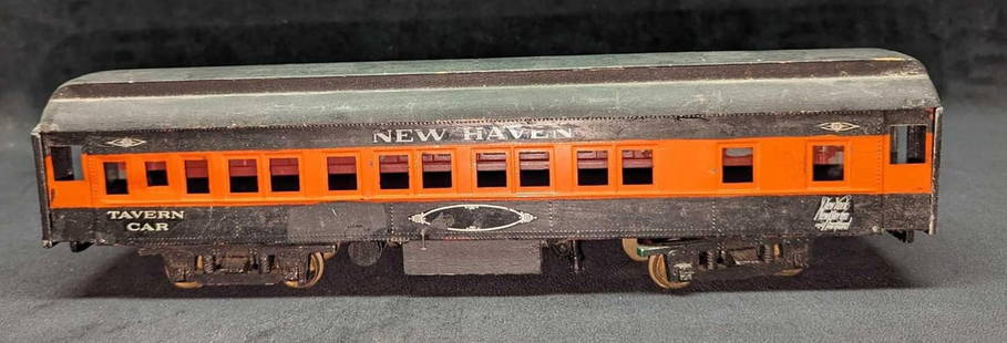 O Scale Passenger Car New Haven Tavern Car: O Scale Passenger Car New Haven Tavern Car. This is approx 13 3/4" x 2 1/2" x 3 1/2 and it weighs 1.56lb. The tavern car appears to have been repainted at one time. The tavern car has some paint loss,