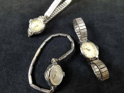Lot of 3 Vintage Womens Watches: This vintage lot of 3 Women&#39;s watches features:  Timex. This watch is in good used condition with some scuffing on band and bezel as well as scratches on glass surface. The elastic band is in grea