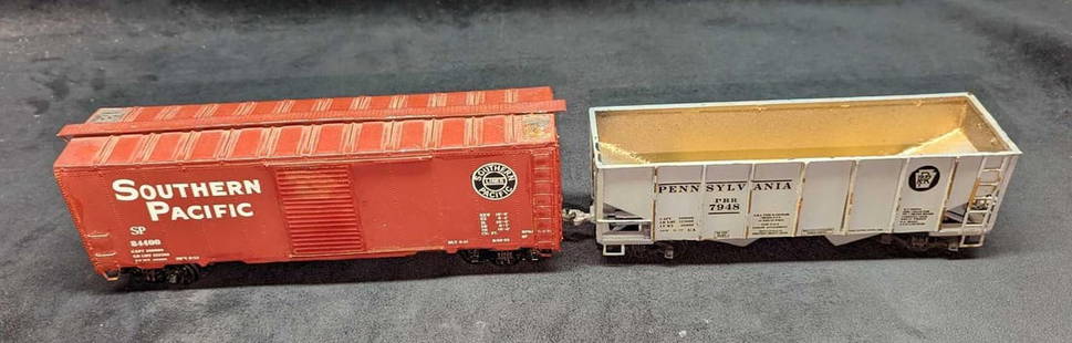 Vintage Distressed O Scale Box Car And Hopper Car: Vintage Distressed O Scale Box Car And Hopper Car. This lot includes:  (1) Southern Pacific 84400 Box Car. This is approx 10 1/2&#34; x 2 1/2&#34; x 3 1/2&#34;. The box car has scratches, chips, and c