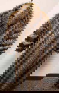 Full Length Raccoon Fur Coat: Full Length Raccoon Fur Coat. This fur coat is in great used condition. The coat has no known signs of damage on the interior or exterior. The coat has a light brown interior fabric lining. The coat h
