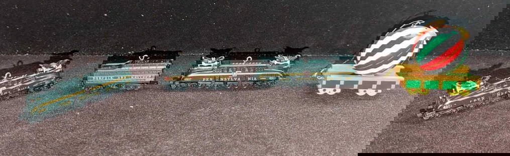 4 Hallmark & AVON Train Christmas Ornaments: 4 Hallmark &amp; AVON Train Christmas Ornaments. This lot includes  (2) Hallmark Keepsake Ornaments - Pennsylvania GG-1 Locomotive Lionel Train. This was released in 1998. Both come in the original bo
