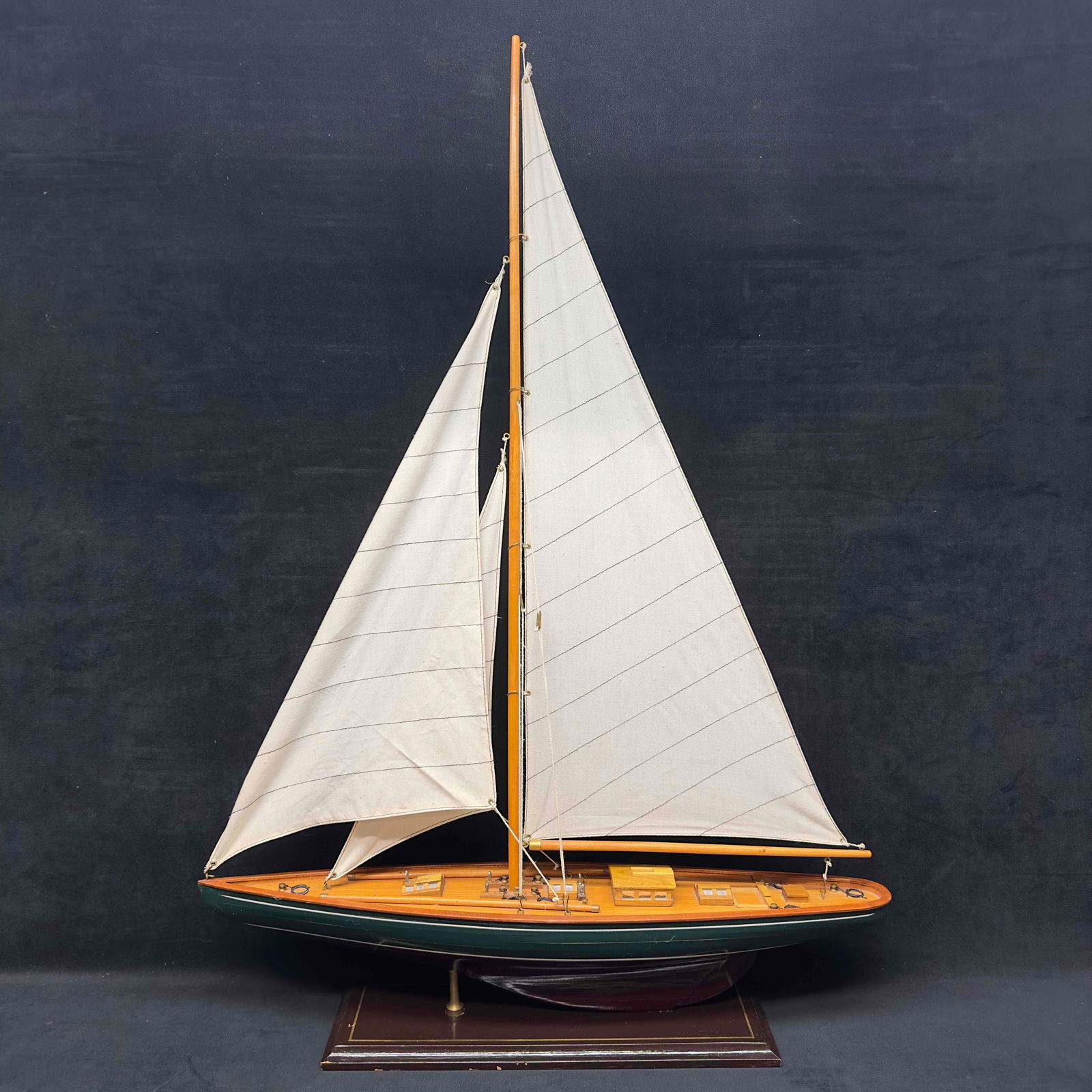 Model Ship Wooden Three 3 Sails Boat Green White Stripe Hull Sailboat: Model Ship Wooden Three 3 Sails Boat Green White Stripe Hull Sailboat. Made in china marked on the bottom of the stand. Sails show light signs of stains. A little dusty but overall good condition. Lig