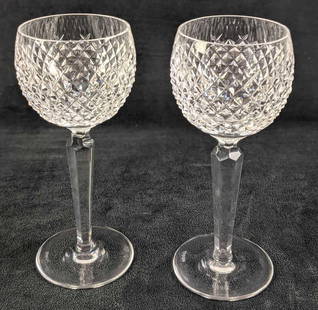 2 Waterford Crystal Alana White Wine Glasses: Two Waterford Crystal Alana White Wine (or "Hock") Glasses. The popular "Alana" cut was originally released by Waterford in the early 1950s. Glasses are approx 3 3/8" x 3 3/8" x 7 1/4" together they w
