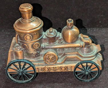 McAllen State Bank Reproduction Steam Fire Truck: McAllen State Bank Reproduction Steam Fire Truck. This brass tone vintage style steam fire truck is approx 5 1/2" x 2 3/4" x 4" and it weighs 1.12lb. This was originally part of a promotion from McAll
