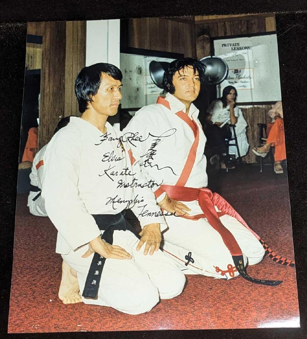 Kang Rhee Autographed Photo Elvis Martial Arts Trainer: Kang Rhee Autographed Photo Elvis Martial Arts Trainer. Elvis trained with Rhee from the years 1970-1974 in Memphis. Elvis was awarded the 8th degree black belt by Rhee in 1974. The photo is