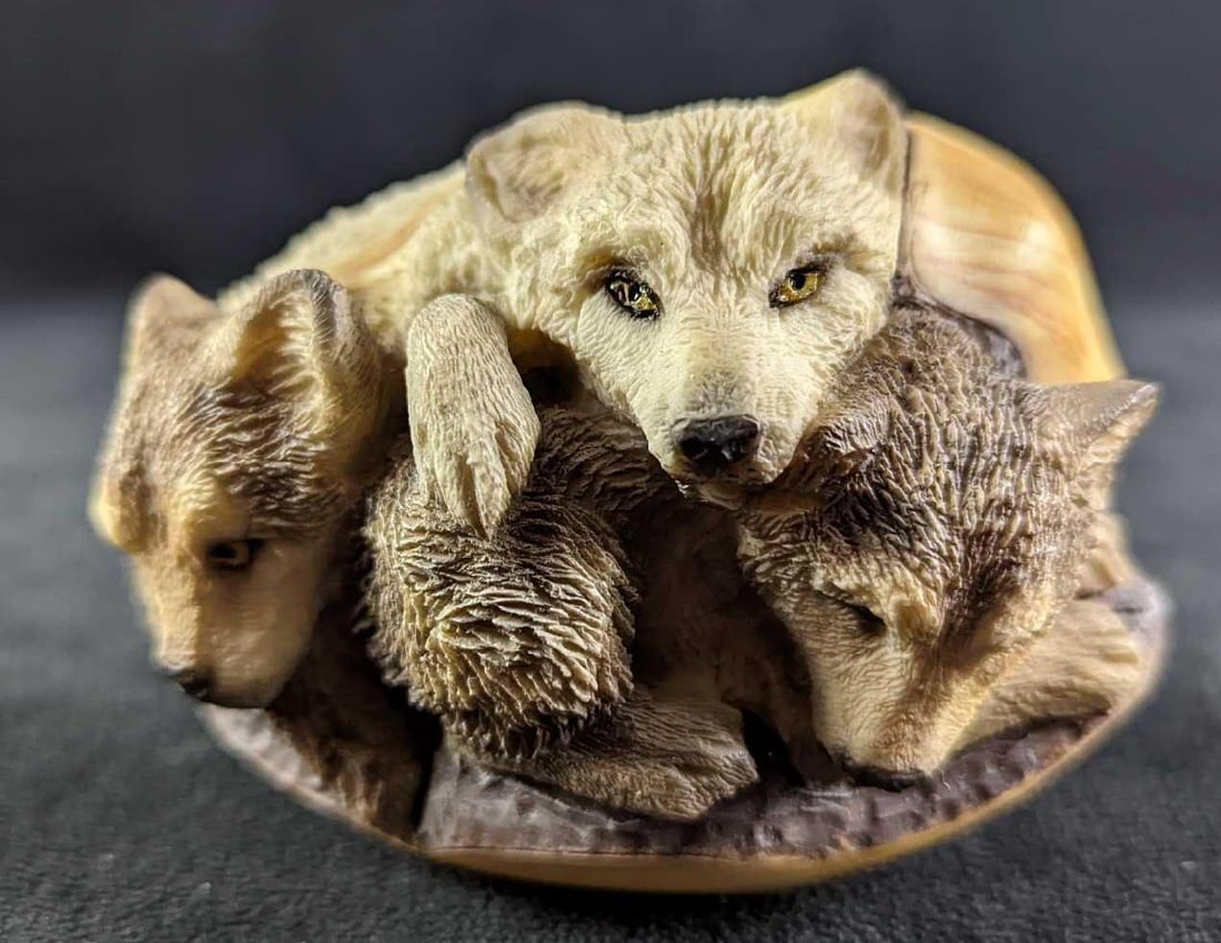 Mills Creek Mother Wolf With Pups Figurine: Mills Creek Mother Wolf With Pups Figurine. Cold cast in porcelain, alabaster powders, and resin. Is approx 4" x 2 1/2" x 2 1/2". Comes in its original box which is approx 4 1/2" x 4 1/2" x 4 1/2" and