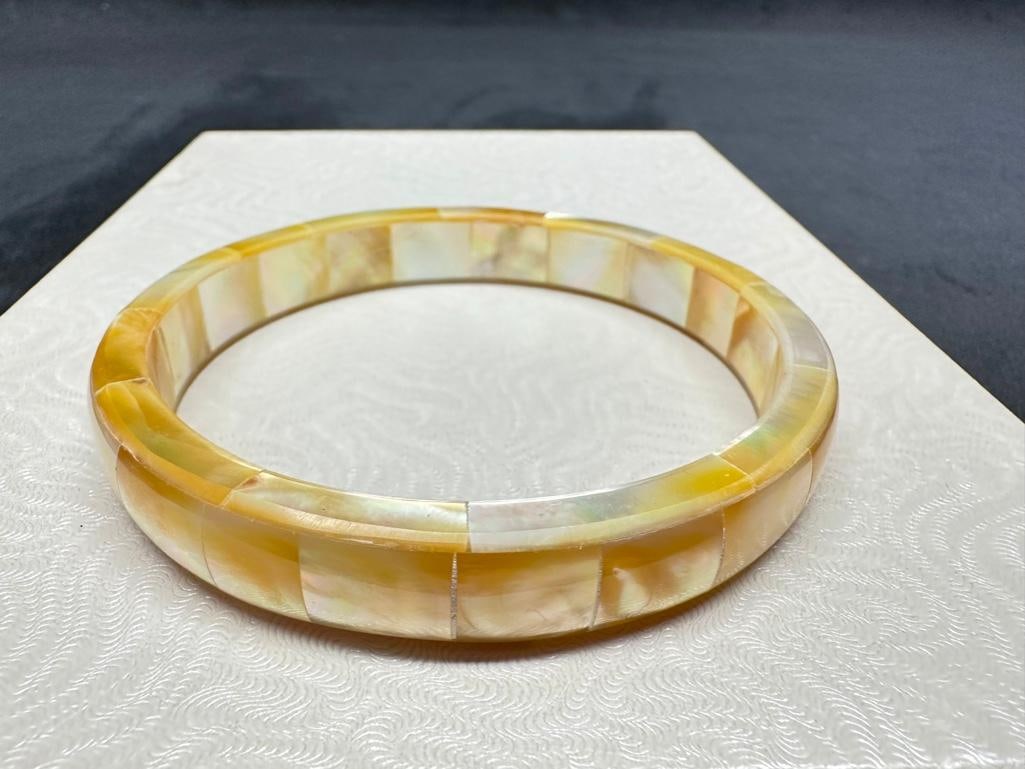 Mother of Pearl Bangle: This piece of jewelry has been tested and researched prior to listing. Please view all our pictures they are part of our description. DETAILS: Metal - none Color - pearlescent Stones - mother of pearl