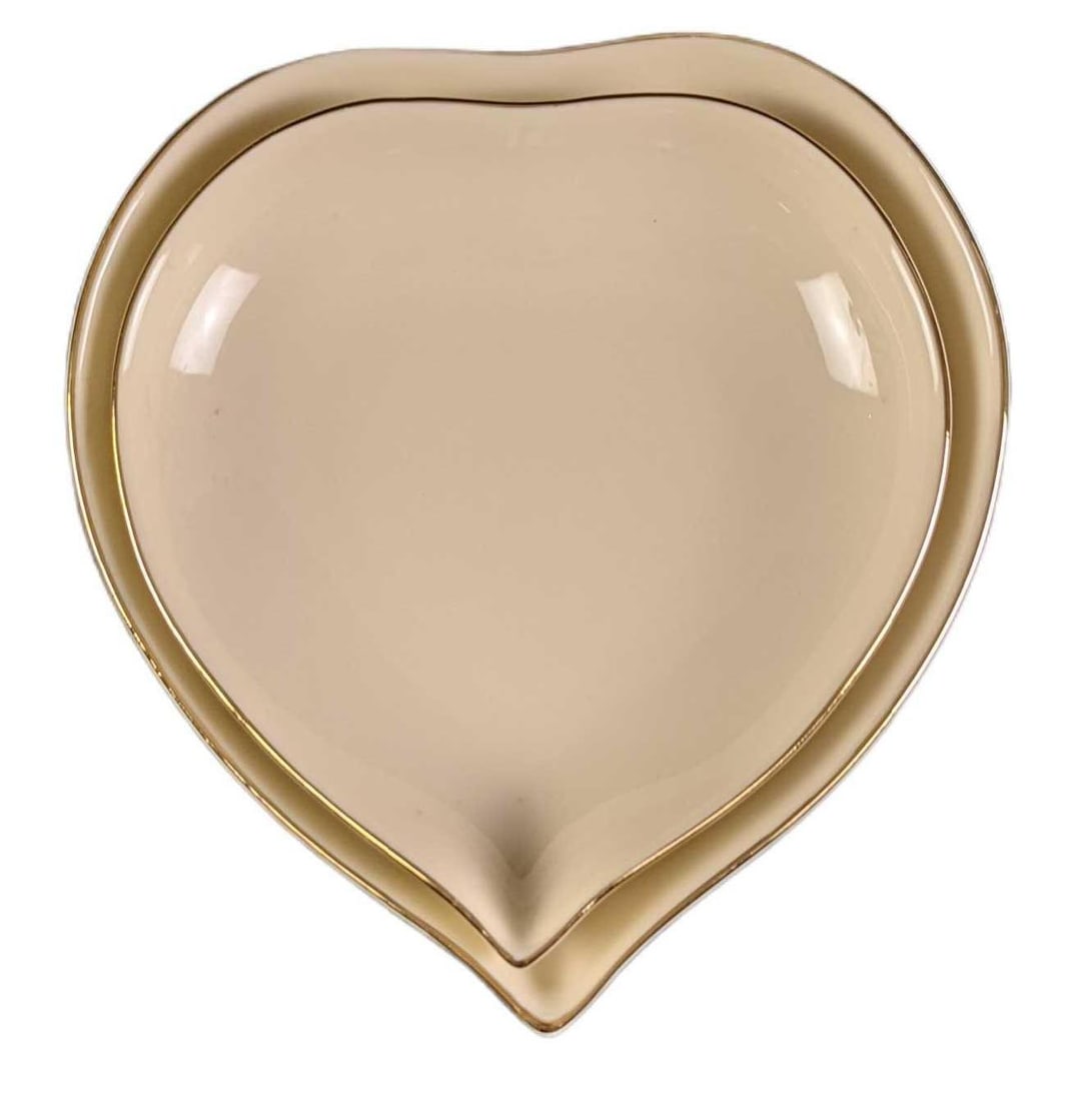 Two Lenox Giftware Fine China Nesting Hearts: Two Lenox Giftware Fine China Nesting Hearts. Made in the year 2000. The larger heart is approx 5" x 5" x 1". The smaller is approx 4 1/4" x 4 1/2" x 1". Together they weigh approx under one pound at