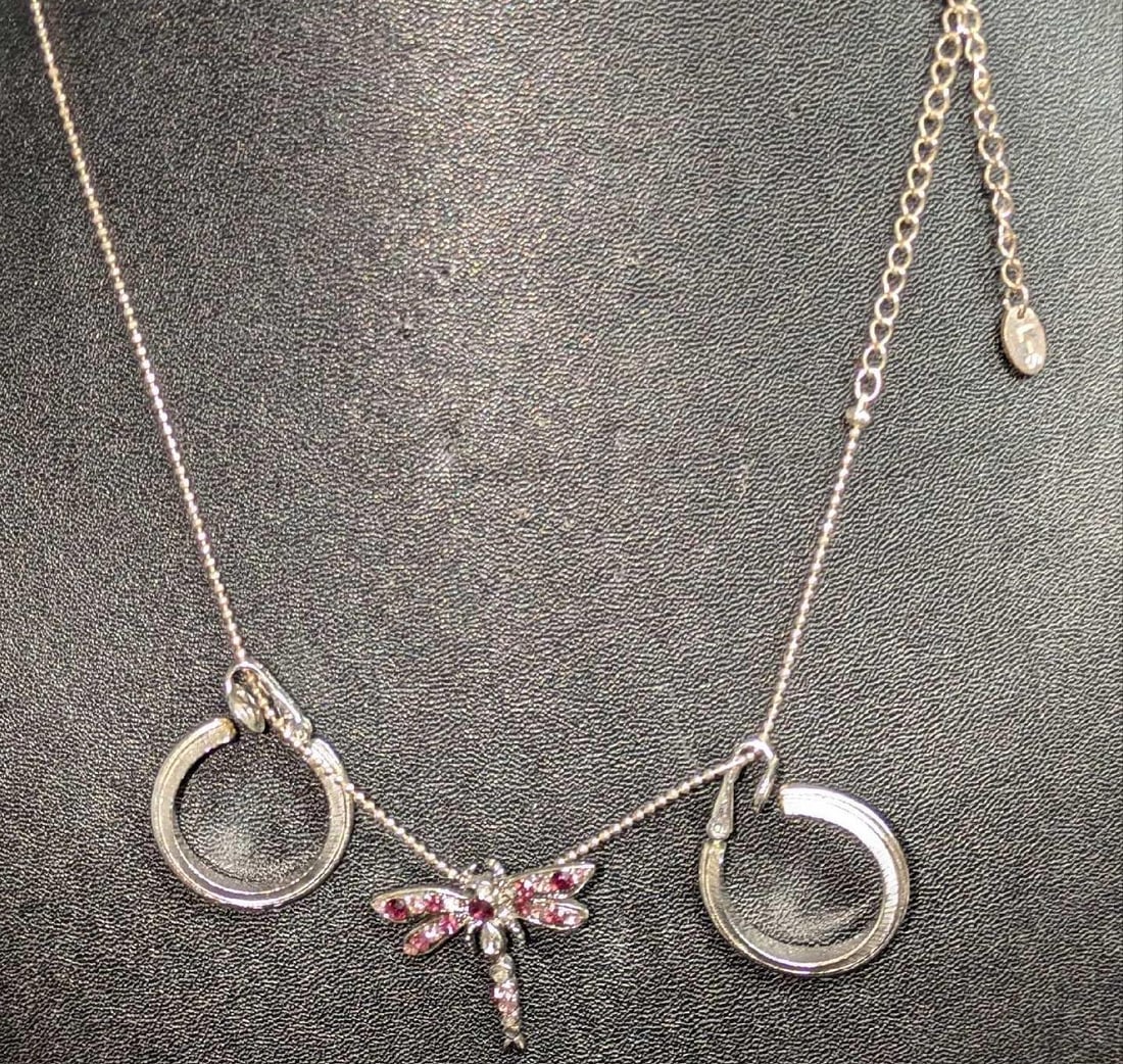 LS Dragonfly Pendant Necklace And Trifari Clip-On Earrings: LS Dragonfly Pendant Necklace And Trifari Clip-On Earrings. This lot includes: (1) LS Silver Tone Rhinestone Dragonfly Pendant Necklace. This is approx 19". (1) Set Of Trifari Clip-On Silvertone