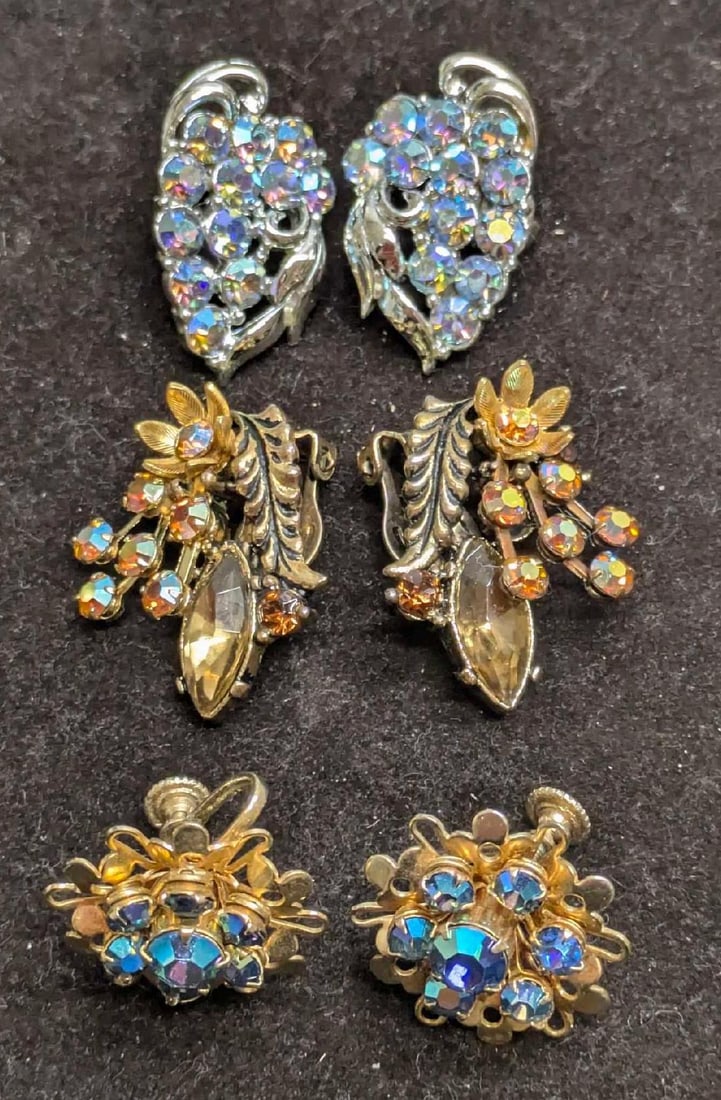3 Vintage Gold And Silver Tone AB Crystal Earrings: 3 Vintage Gold And Silver Tone AB Crystal Earrings. This lot includes: (1) Set Of Clip On Silver Tone Coro AB Crystals Earrings. Each is approx 1 1/4" x3/4" x 1/2". (1) Set Of Unmarked Sc