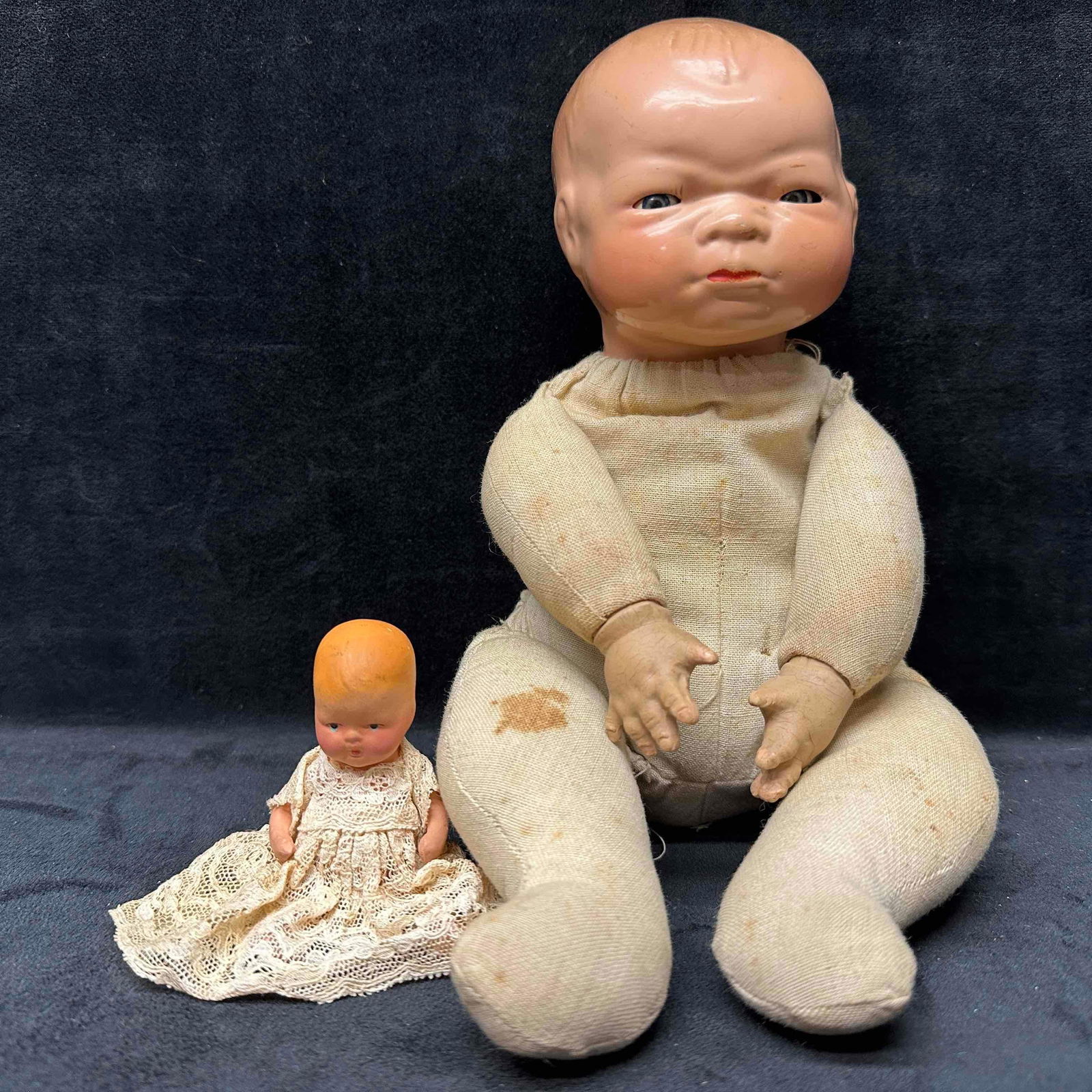 Antique Grace Storey Putnam Bye Lo and Painted Bisque Baby Doll Set Composition Dolls: Each dolls has imperfections light rips and holes, discoloring, minor cracking, and staining. These items are in good pre-owned, previously displayed condition with light wear, and surface scratches.