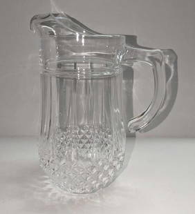 Vintage 9" Diamond Pattern Glass Pitcher: Vintage 9" Diamond Pattern Glass Pitcher. This is approx 7" x 5" x 9 3/8" and it weighs 2.83 lbs. The maker and date of creation are unknown. The pitcher is in a good, vintage condition with no chips