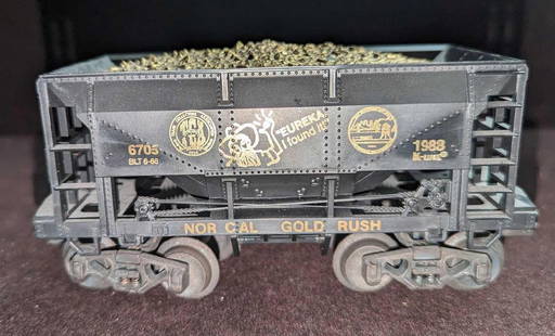 K-Line 1988 TCA National Convention Gold Rush Ore Car: K-Line 1988 TCA National Convention Gold Rush Ore Car. This is approx 7 1/4" x 2 1/2" x 3". It comes in its original box that is approx 10" x 2 7/8" x 4 1/4" and it weighs 0.76