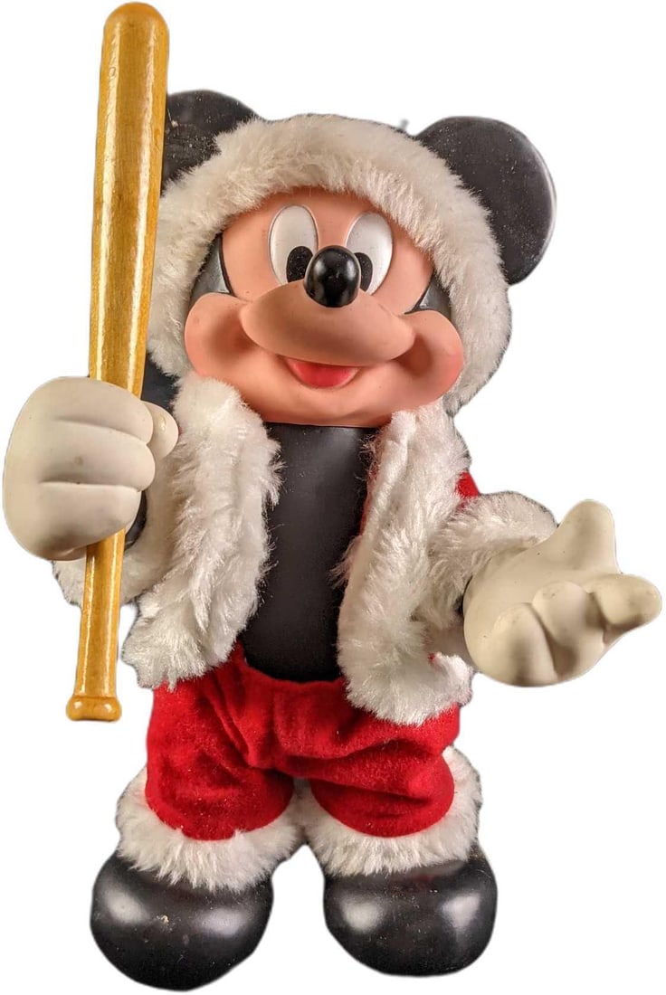 Disney Rubber Santa Mickey Mouse With A Bat: Disney Rubber Santa Mickey Mouse With A Bat. He used to carry a bell, now he has a bat! Is approx 6" x 5" x 11" and it weighs under one pound at 0.72lb. Fully posable. The doll has some markings on it