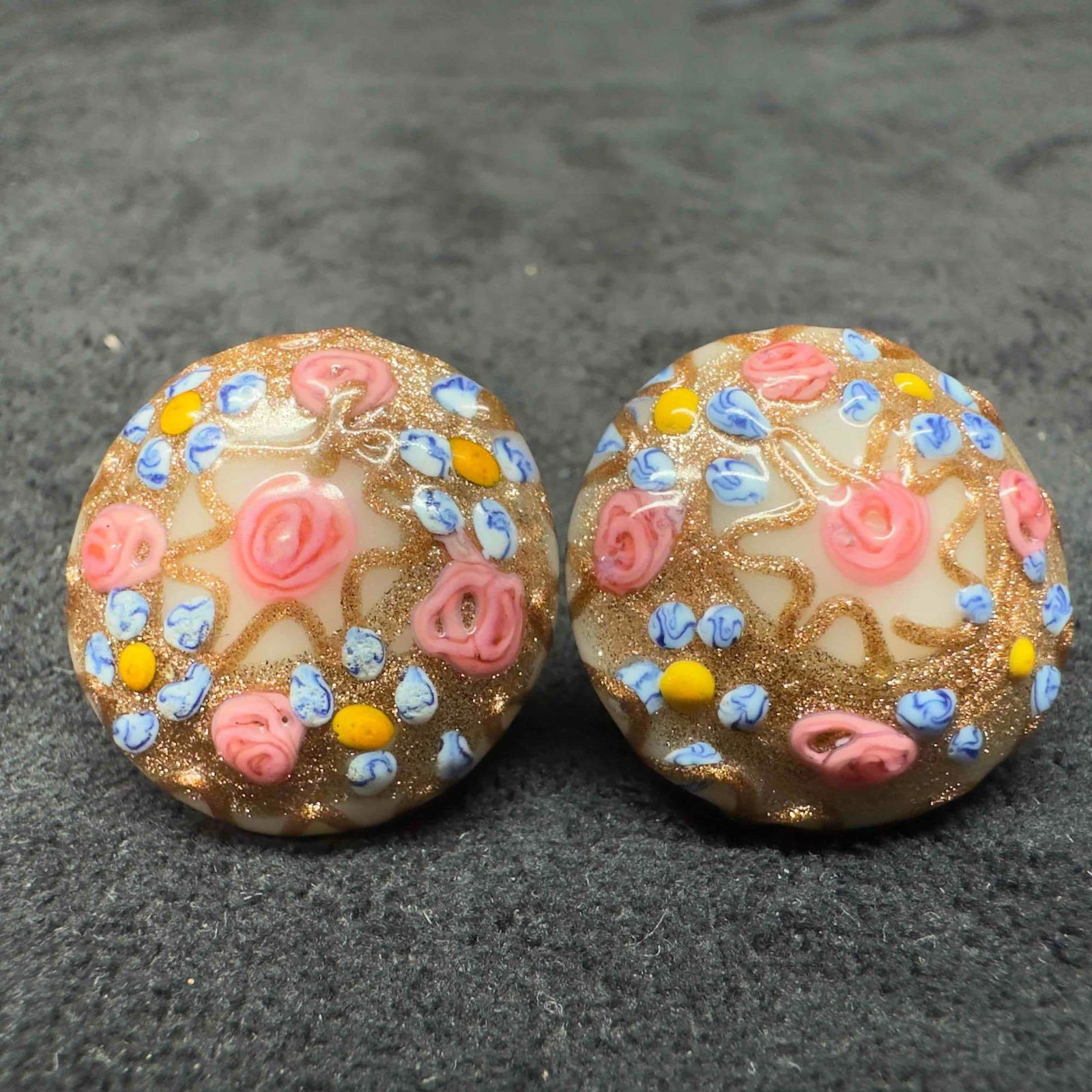 Murano Venetian Lamp Work Art Glass White Copper Accents Blue Pink Floral Circle Bead Earrings F41: Murano Venetian Lamp Work Art Glass White Copper Accents Blue Pink Floral Circle Bead Earrings F41. Earrings with white glass beads with beautiful designs on each. The earrings feature pink floral and