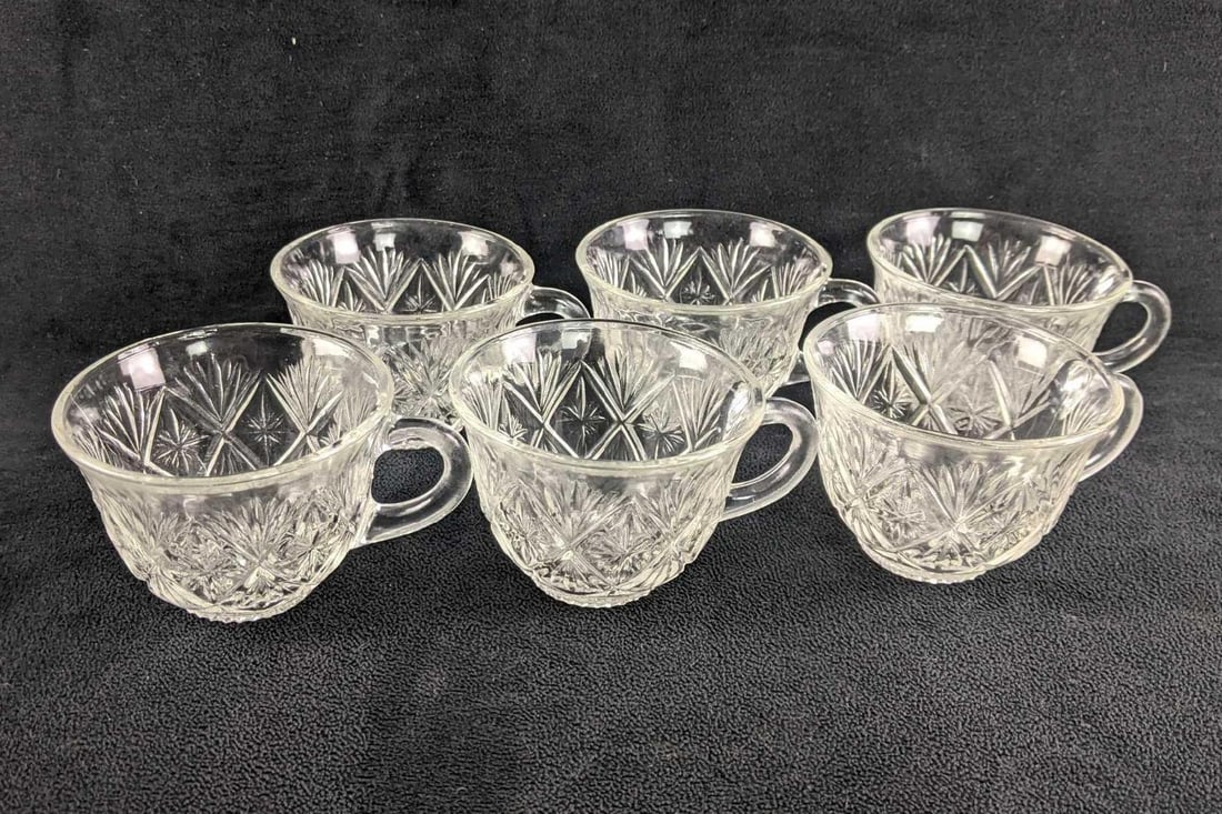 Six Vintage Glass Tea Cups Starburst Design: Six Glass Tea Cups Starburst Design This is a set of six pressed glass teacups that have small starburst designs all around the cup. These are in good condition with no known major damage, they may ha