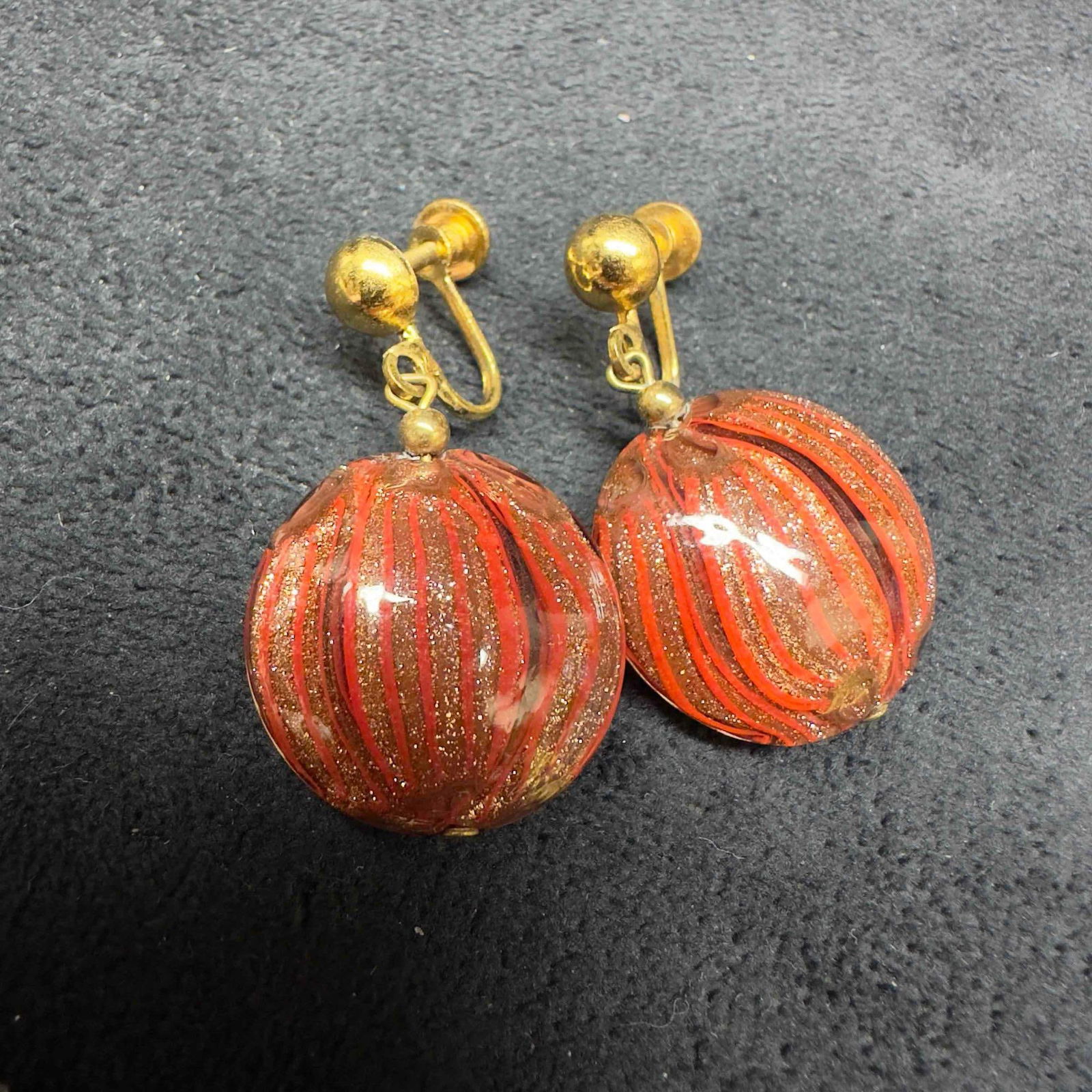 Murano Venetian Art Glass Lamp Work Copper Circle Red Striped Dangle Earrings D86: Murano Venetian Art Glass Lamp Work Copper Circle Red Striped Dangle Earrings D86. Earrings with red glass beads with beautiful designs on each. The earrings feature copper colored accents. The earrin