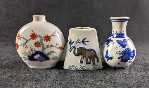Assorted Small Chinese Ceramic Vases: Assorted Small Chinese Ceramic Vases This lot comes with three small ceramic vases. These vases are all in good condition just some wear on the bottoms where they sit. The paint on all of the vases is