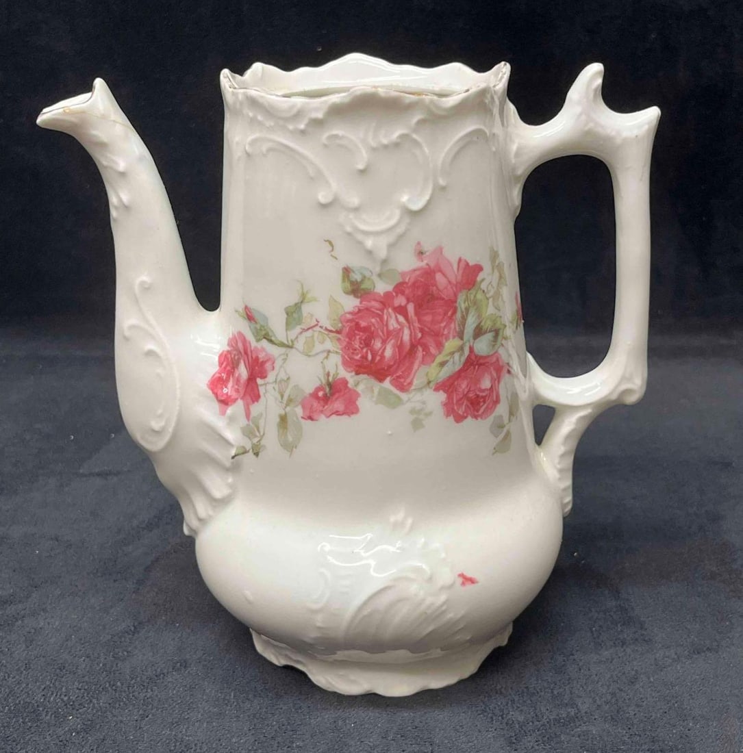 White Tea Pot With Pink Roses No Lid: This lot contains a White Tea Pot With Pink Roses No Lid. It is approx 7" x 4" x 6 3/4". Total weight is 0.9lbs. Overall the Tea Pot is in average used condition with some wear from use over time. The