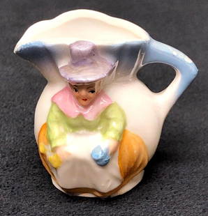 Vintage German Porcelain Miniature Pitcher Lady: Vintage Miniature Porcelain Miniature Pitcher with Figural Lady. Made in Germany. Marked 1128. The Vintage Miniature Porcelain is approximately 2" x 2-1/4" x 1-1/4" and weighs about 0.1lbs. Overall th