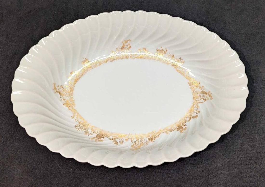 Retired Haviland Ladore 10" Oval Vegetable Bowl: Retired Haviland Ladore 10" Oval Vegetable Bowl. This Gold on White series of fine china was released in 1962 - 1988. The vegetable bowl is approx 10 3/4" x 7 1/2" x 2 1/4" and it weighs 1.25lbs. The 