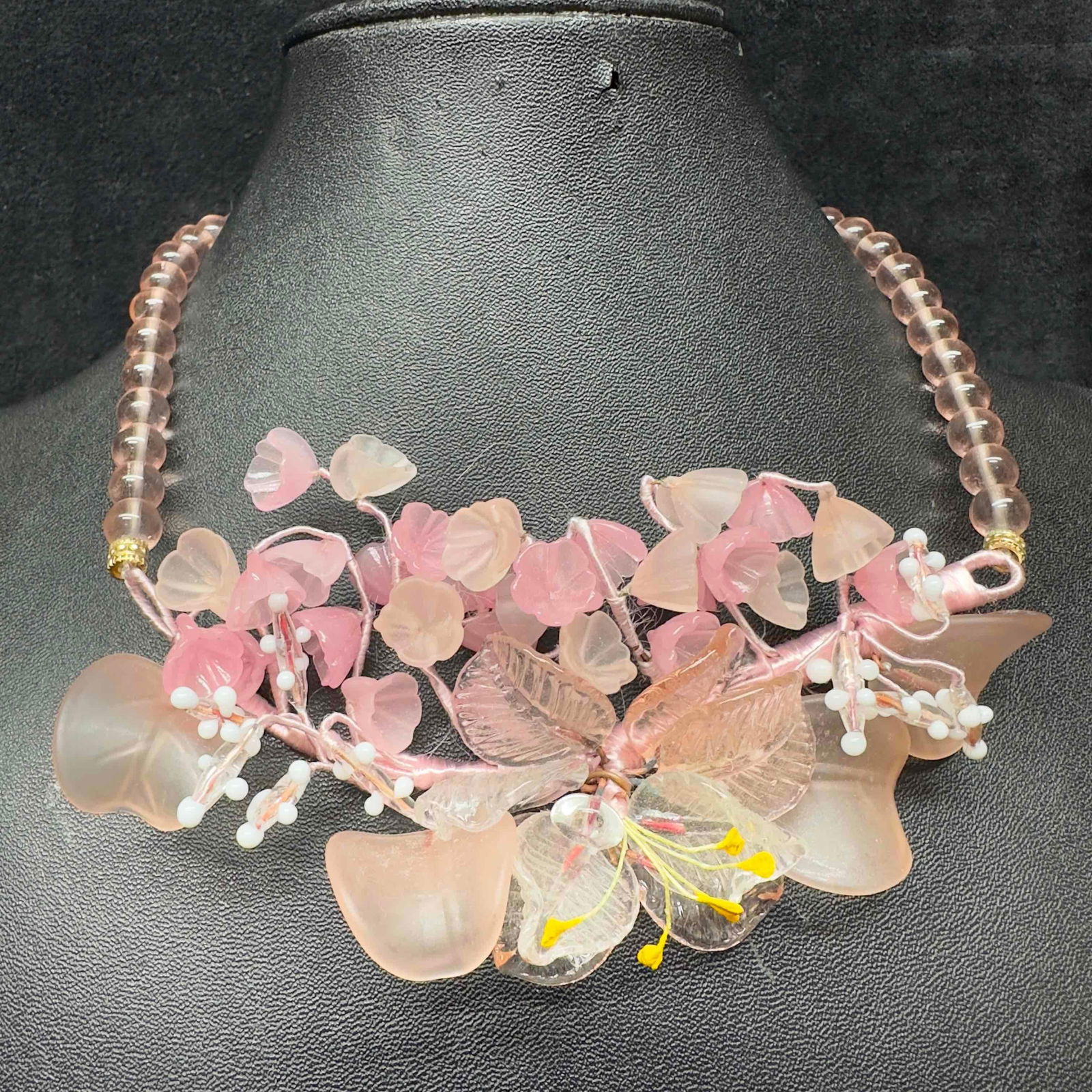 Glass Lamp Work Bead Pink Flower Floral Shaped Beaded Necklace I48: Glass Lamp Work Bead Pink Flower Floral Shaped Beaded Necklace I48. Necklace with pink colored glass beads with beautiful designs on each. The necklace features pink colored flower shaped accents. Gra
