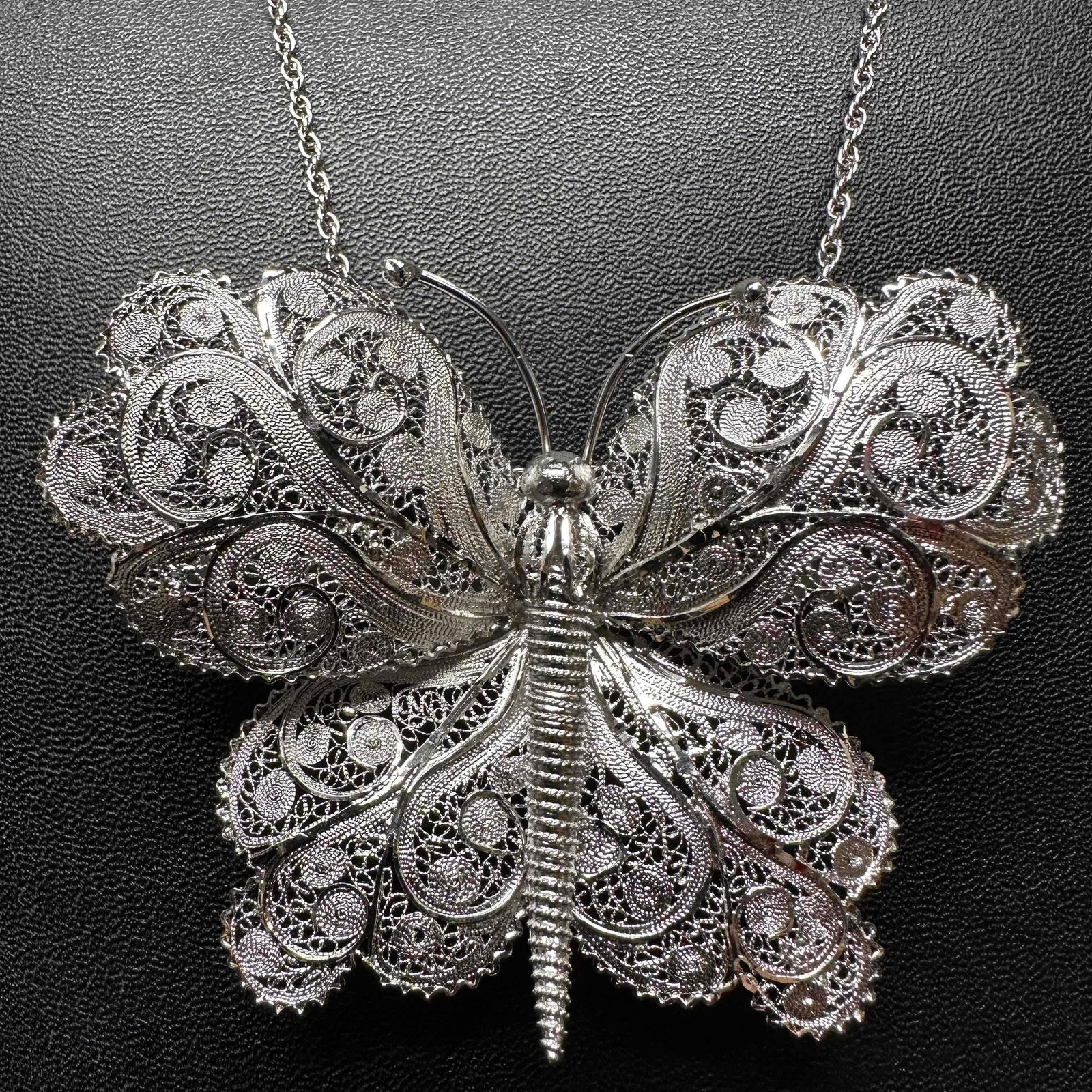 Van Lou Sterling Silver Necklace and Filigree Butterfly Pendant H19: This item is in good pre-owned, previously used/displayed condition with noticeable light wear, and surface scratches. Please reference all photos for full details. This piece of jewelry has been test
