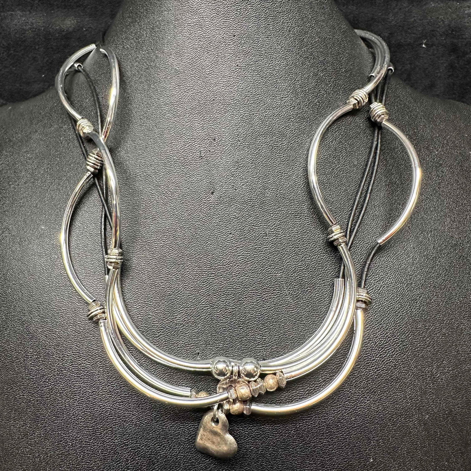 Lizzy James Bracelet and Necklace Set California Jewelry: This set of Lizzy James necklaces can be worn as bracelets if desired, both showcase a paw print or heart motif accent. Black Lizzy James dust jacket bag included. These items are in good pre-owned, p