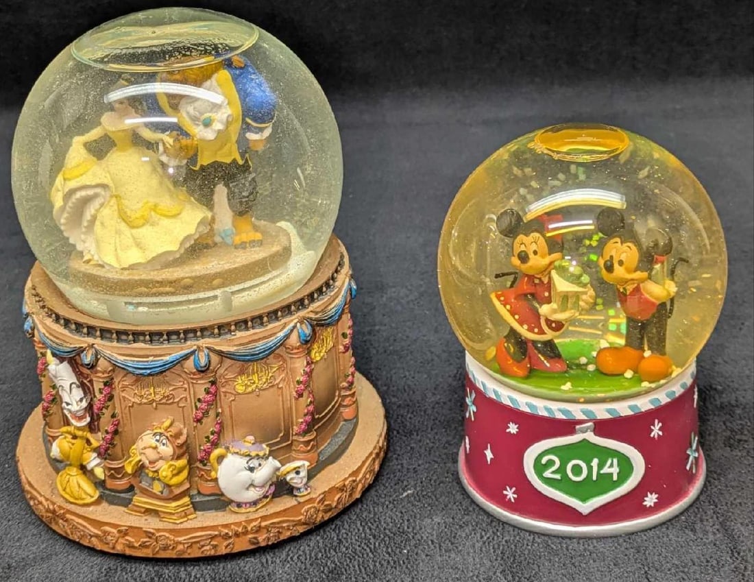 Disney Beauty & The Beast And Christmas Snowglobes: Disney Beauty & The Beast And Christmas Snowglobes. This lot includes: (1) Beauty And The Beast Resin Musical Snowglobe. This is approx 4 5/8" x 4 5/8" x 5 1/2". By Kcare. The water i