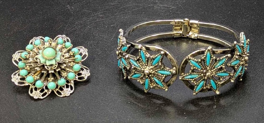 Silver and Turquois Colored Bracelet and Brooch: Silver and Turquois Colored Bracelet and Brooch This is a lot of 2 one bracelet and one brooch The bracelet is lightly used in good condition and is missing some of the faux turquois. The brooch is gl