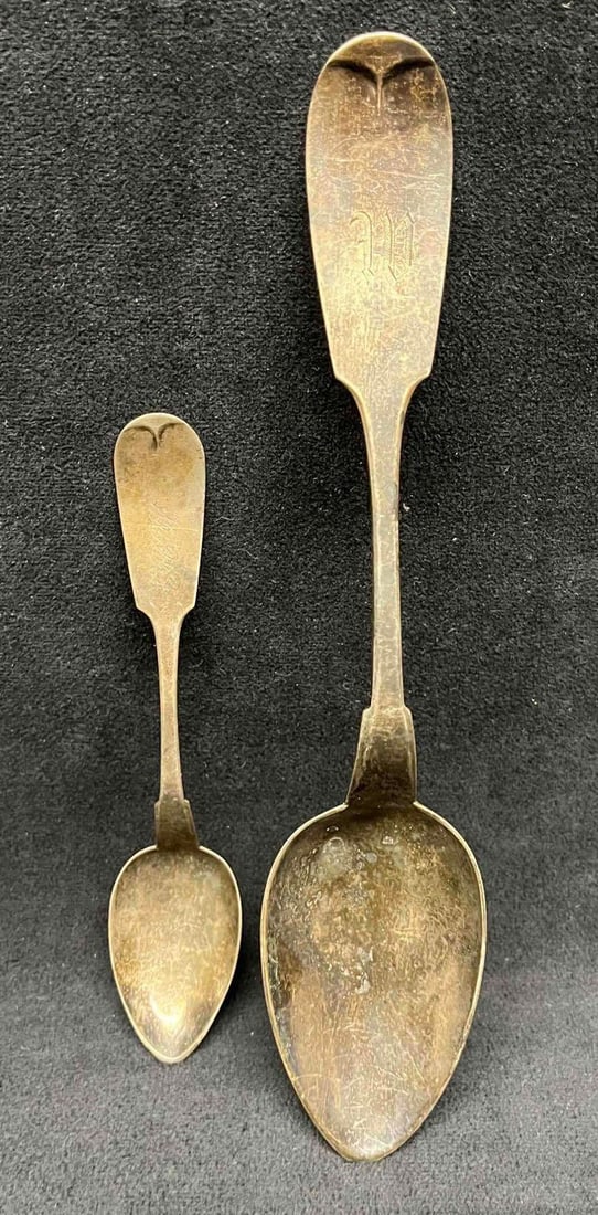 Two Hotchkiss & Schreuder 90% Silver Spoons: This lot contains Two Hotchkiss & Schreuder 90% Silver Spoons. The larger spoon is engraved with a W and the small spoon is engraved Mrs.W. The large is spoon is approx 8 3/4" x 1 3/4" x 3/4" and